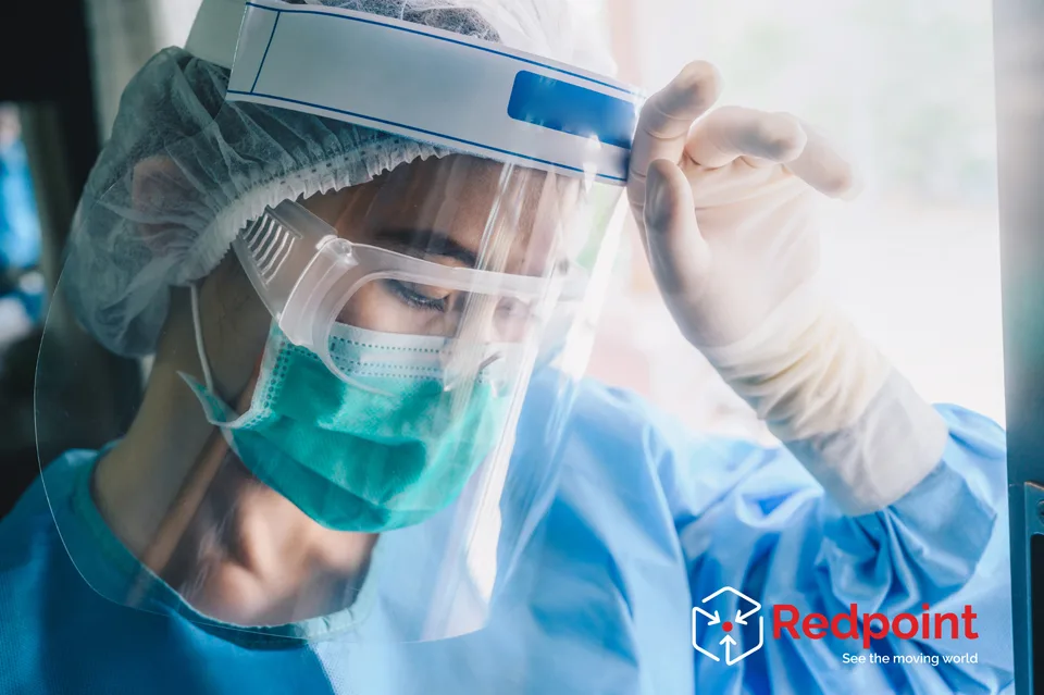 Nurse having headache and tired from work while wearing PPE suit for protect coronavirus disease.