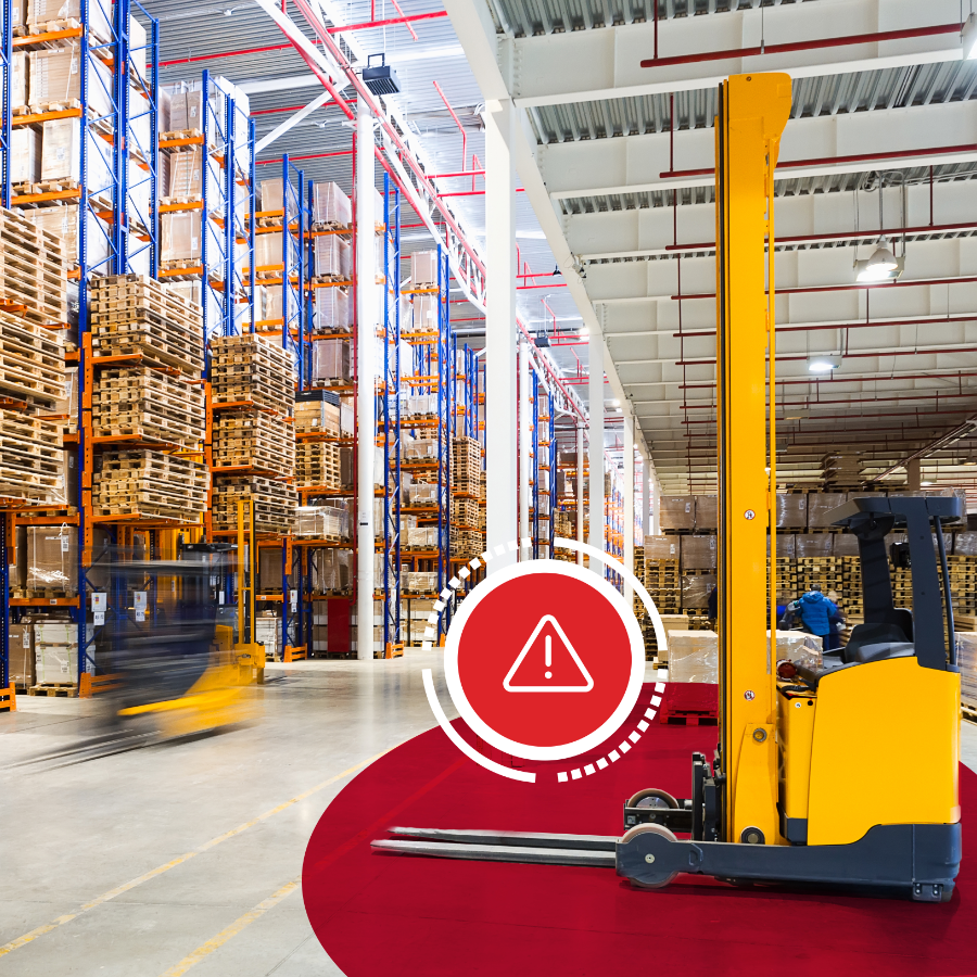 Three warehouse employees wearing helmets