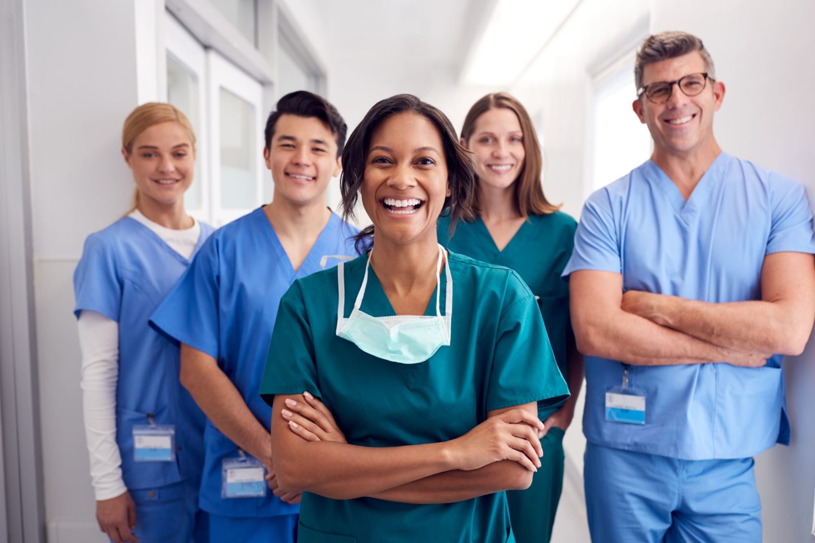 A smiling team of nurses and doctors in scrubs